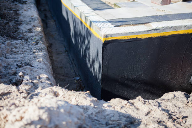 Professional Waterproofing technician working in Dowagiac, MI